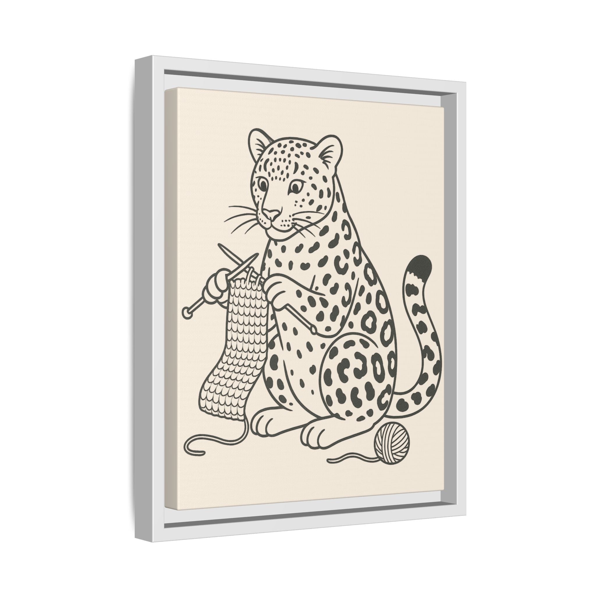 Framed artwork of an amur leopard knitting on a beige background