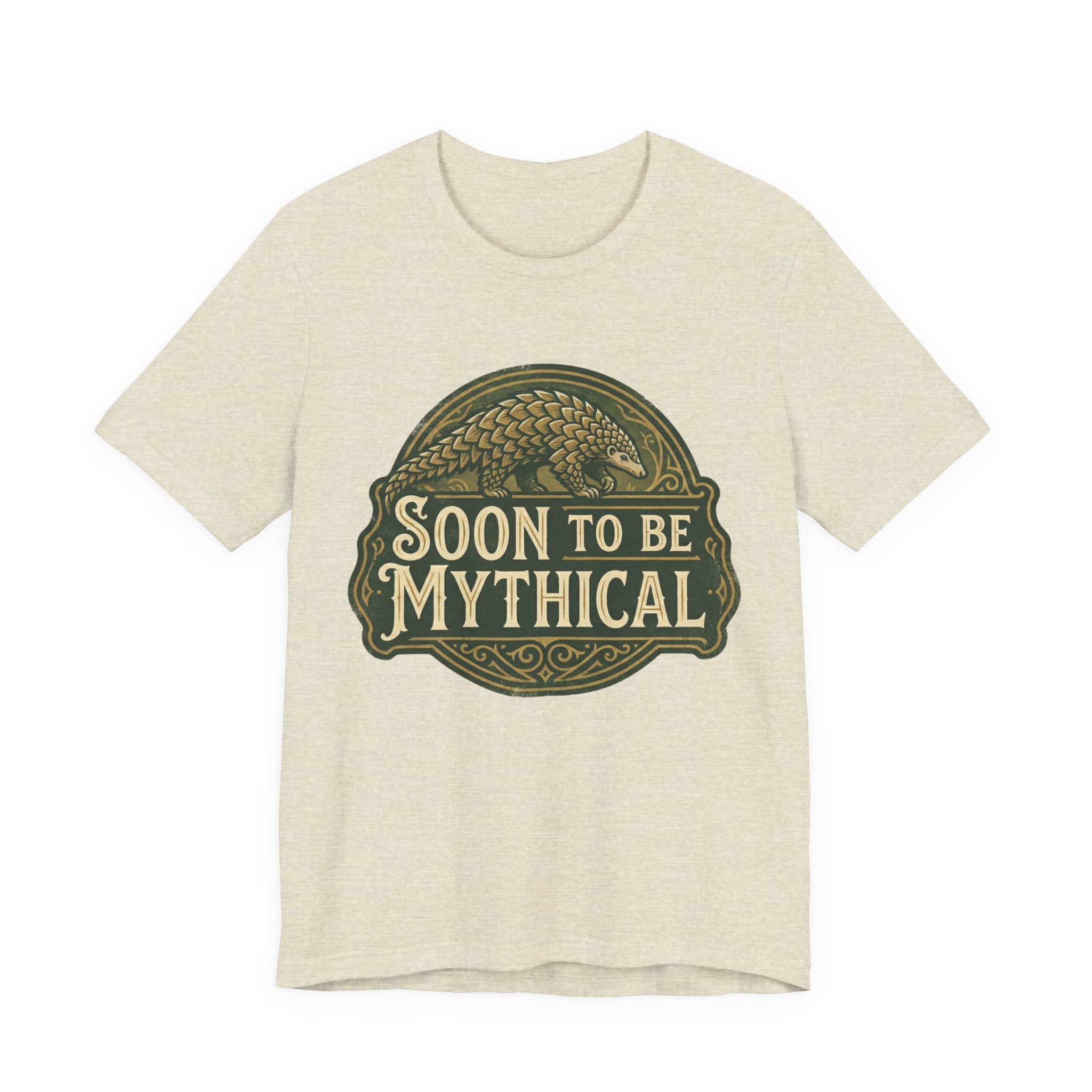 Heather beige t-shirt with 'Soon to be Mythical' vintage logo with a pangolin on a white background