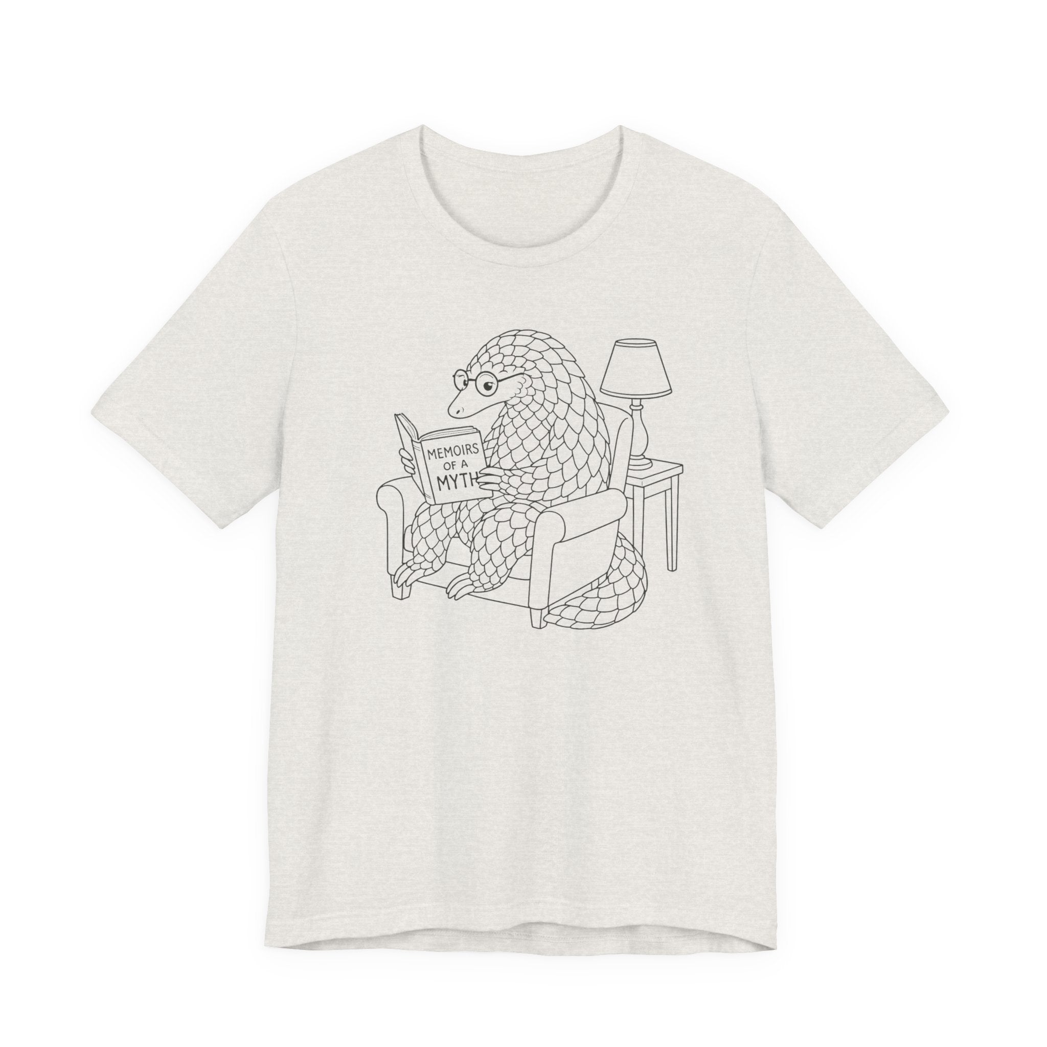 Heather cement t-shirt with a graphic of a pangolin reading a book titled 'Memoirs of a Myth' on a white background