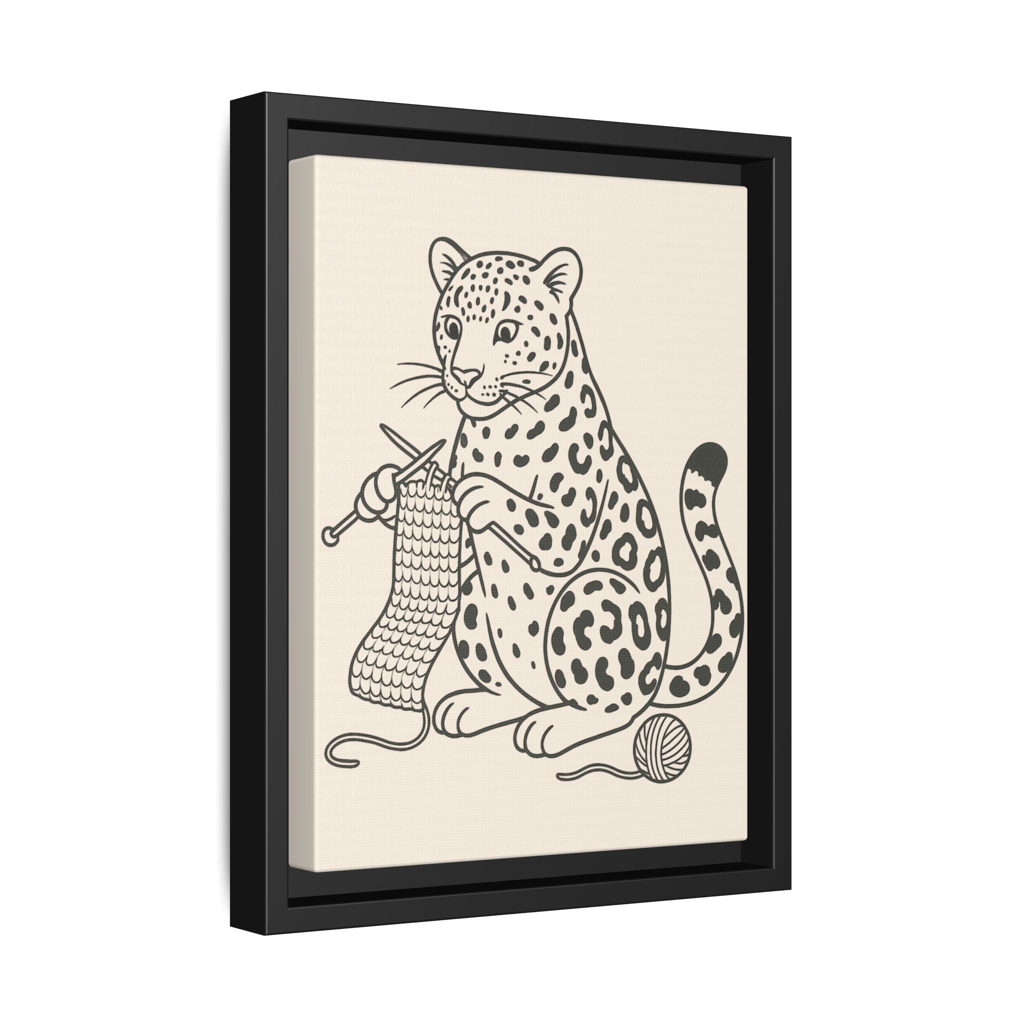 Framed artwork of an amur leopard knitting with yarn on a beige background