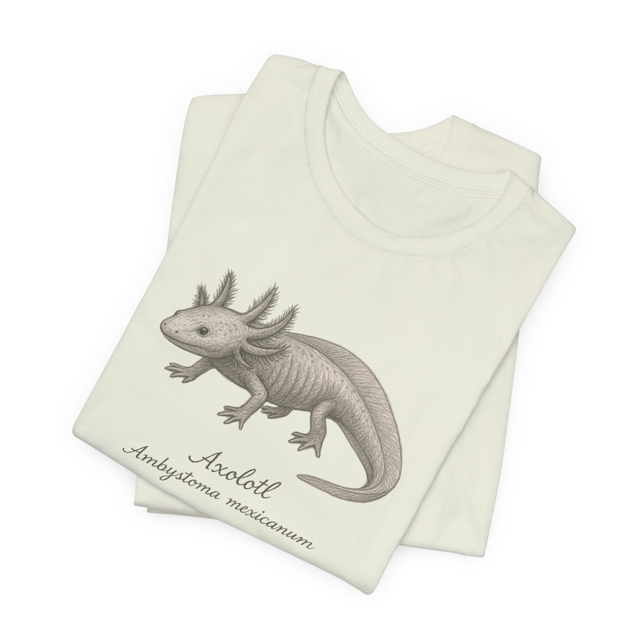 Folded citron t-shirt with axolotl illustration and text on a white background