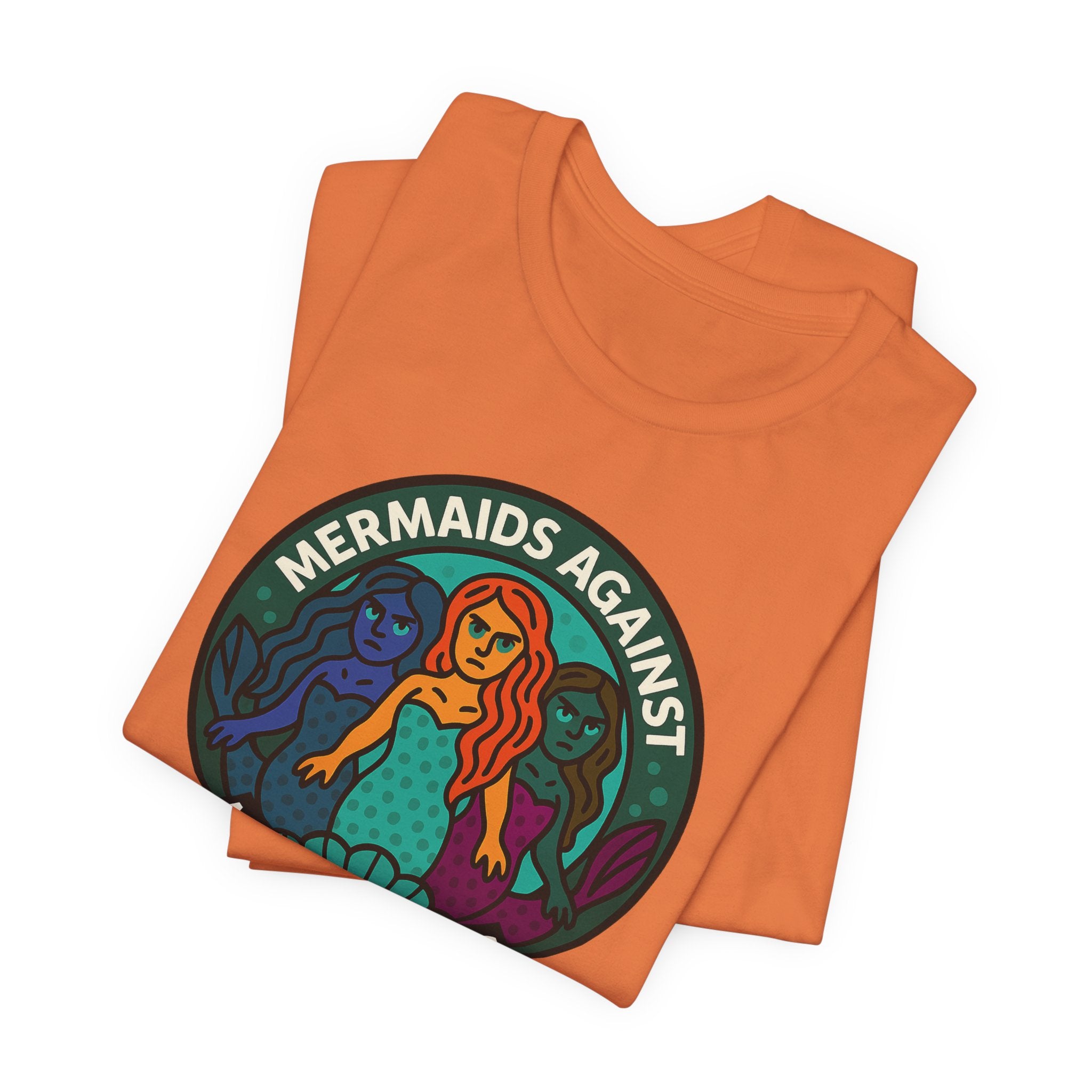 Orange t-shirt with mermaid graphic and text 'Mermaids Against Microplastics' by Soon To Be Mythical