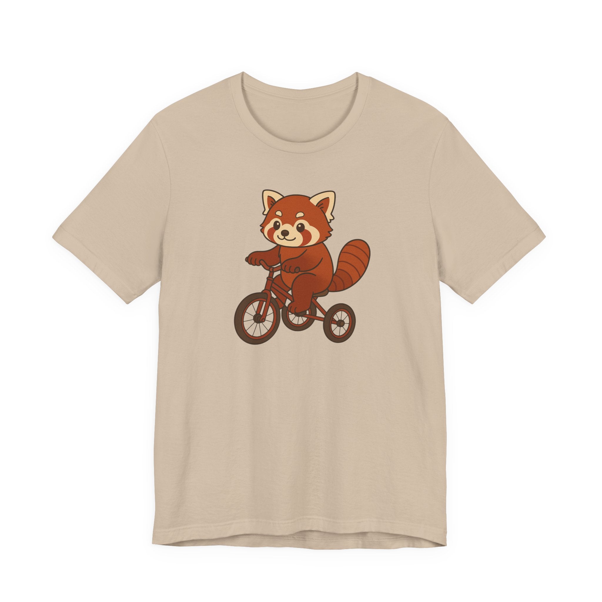 Tan t-shirt with a red panda riding a tricycle graphic on a white background