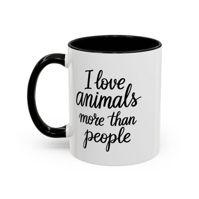 White mug with black interior and handle, featuring the text 'I love animals more than people' on one side and "Postpone the myth" by Soon To Be Mythical