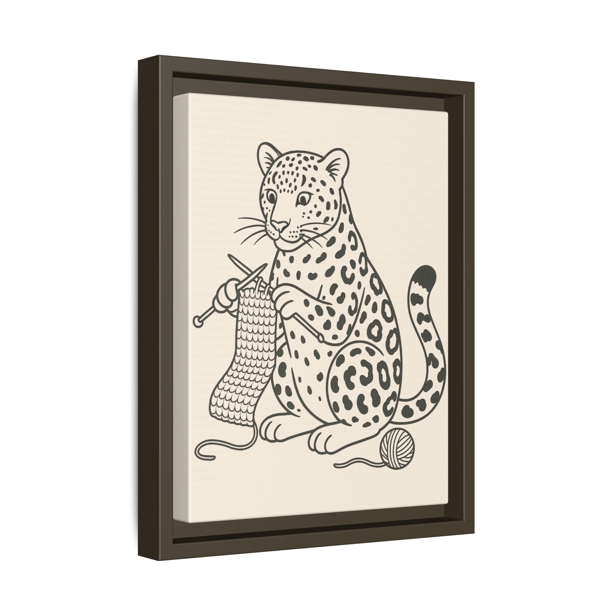 Framed artwork of an amur leopard knitting with yarn on a beige background