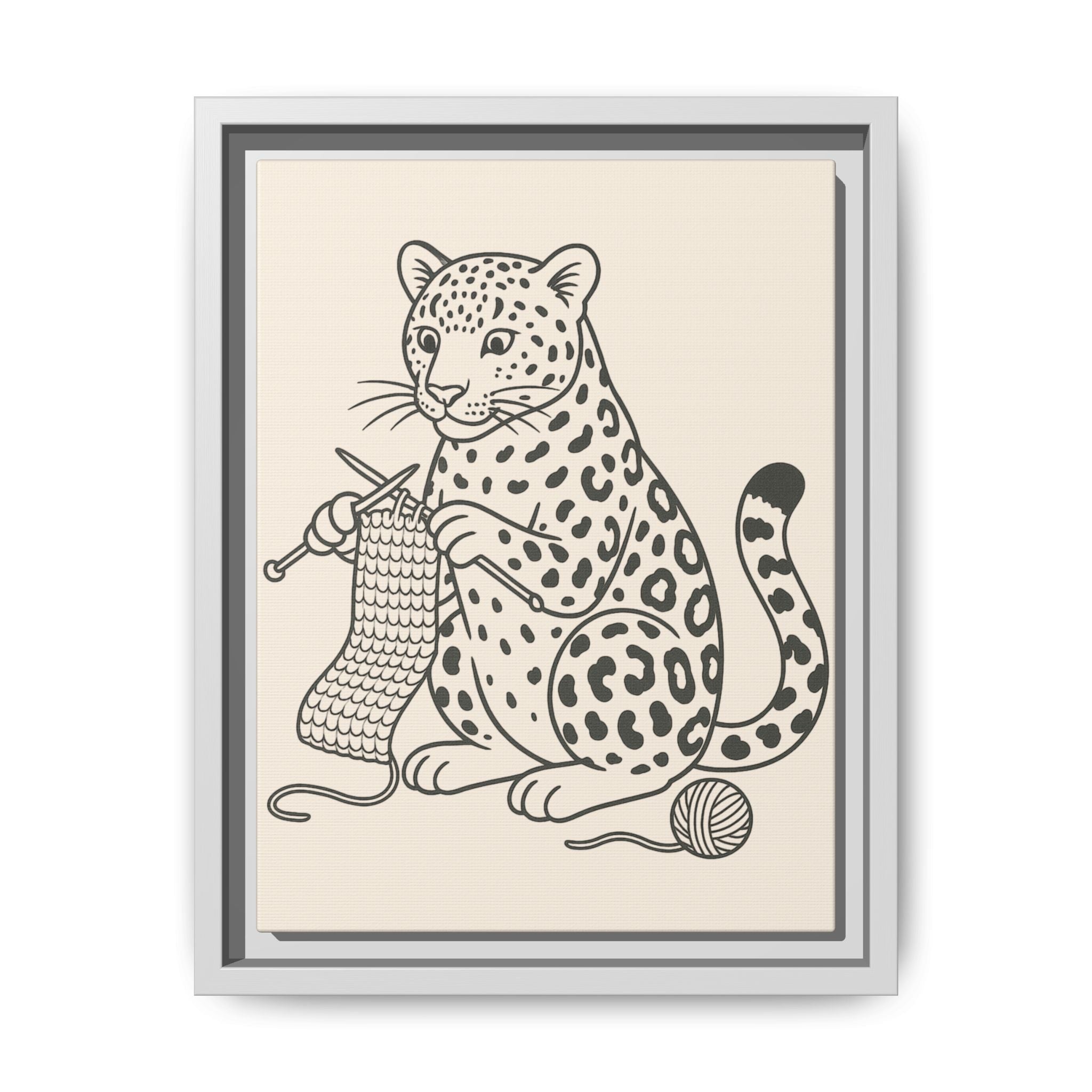 Framed artwork of an amur leopard with knitting needles and yarn on a beige background