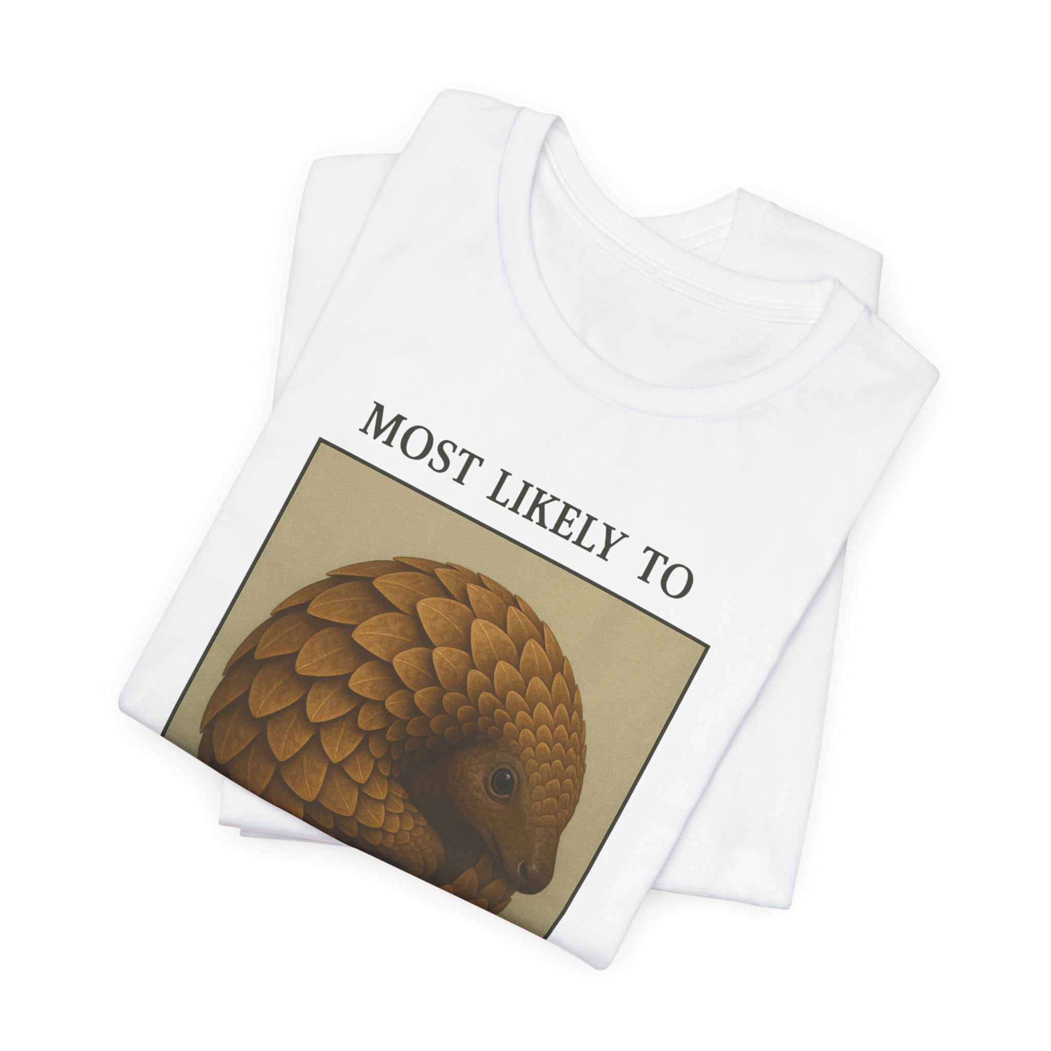 White t-shirt with a yearbook style photo of a pangolin that says "Most Likely to Turn Into a Pinecone Under Stress"