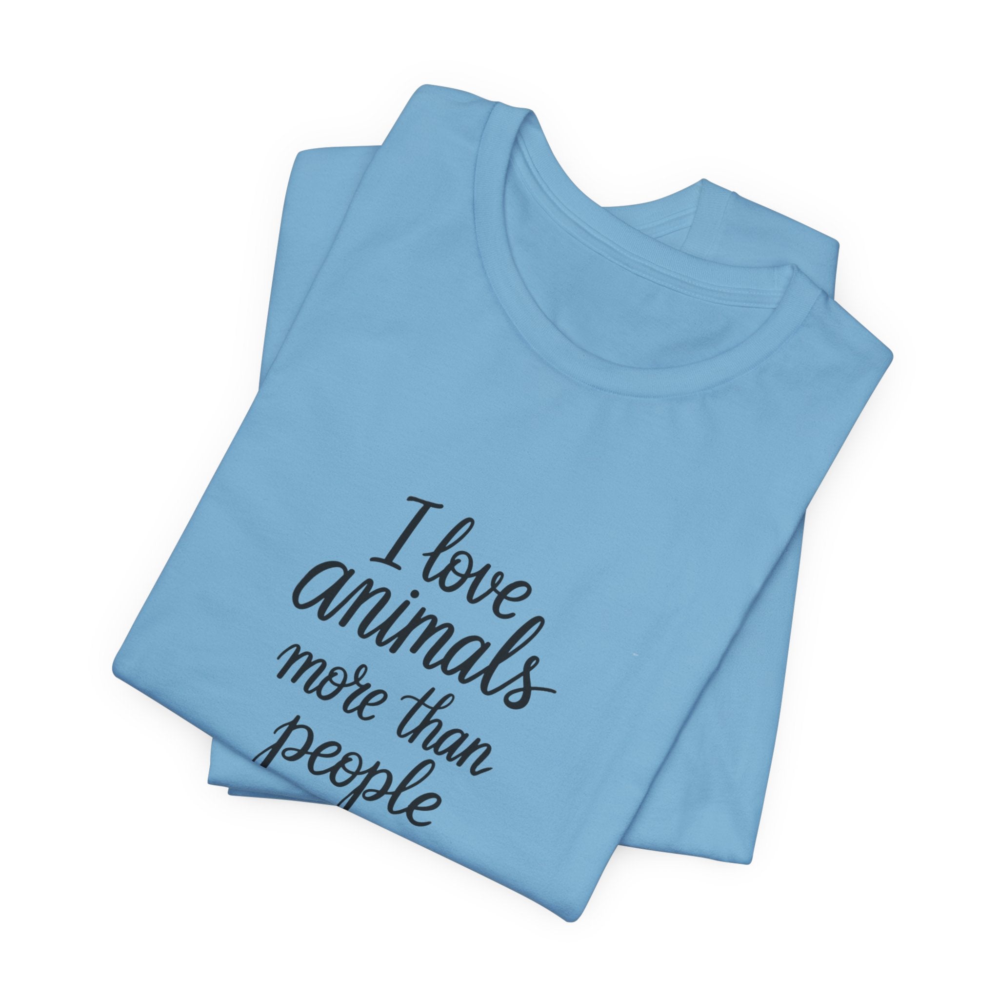 Light blue t-shirt with the text "I Love Animals More Than People" on the front and the text "Postpone the Myth" on the left sleeve on a white background