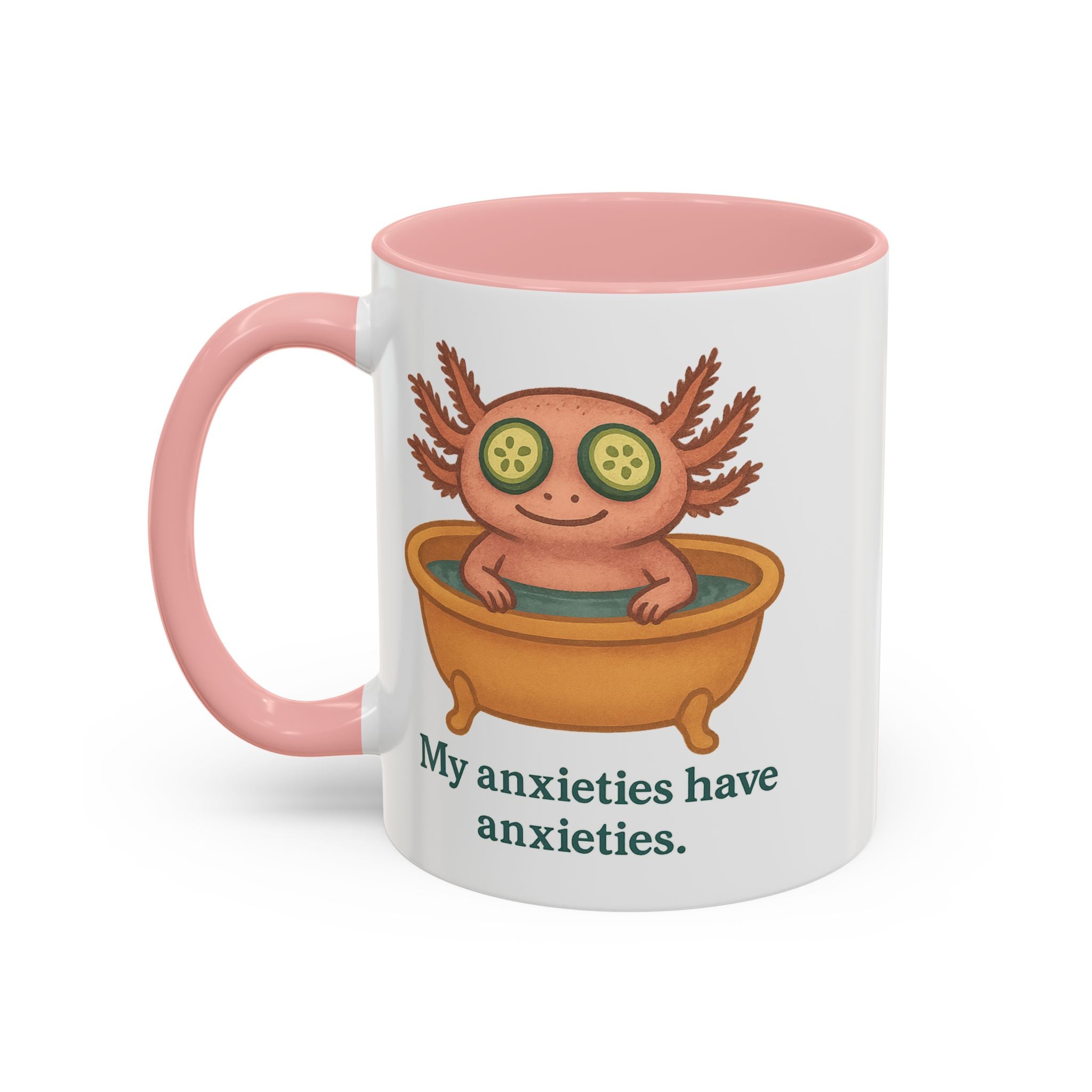 White mug with pink interior and handle color accent featuring a graphic of a cute axolotl taking a relaxing bath with the text "My anxieties have anxieties."