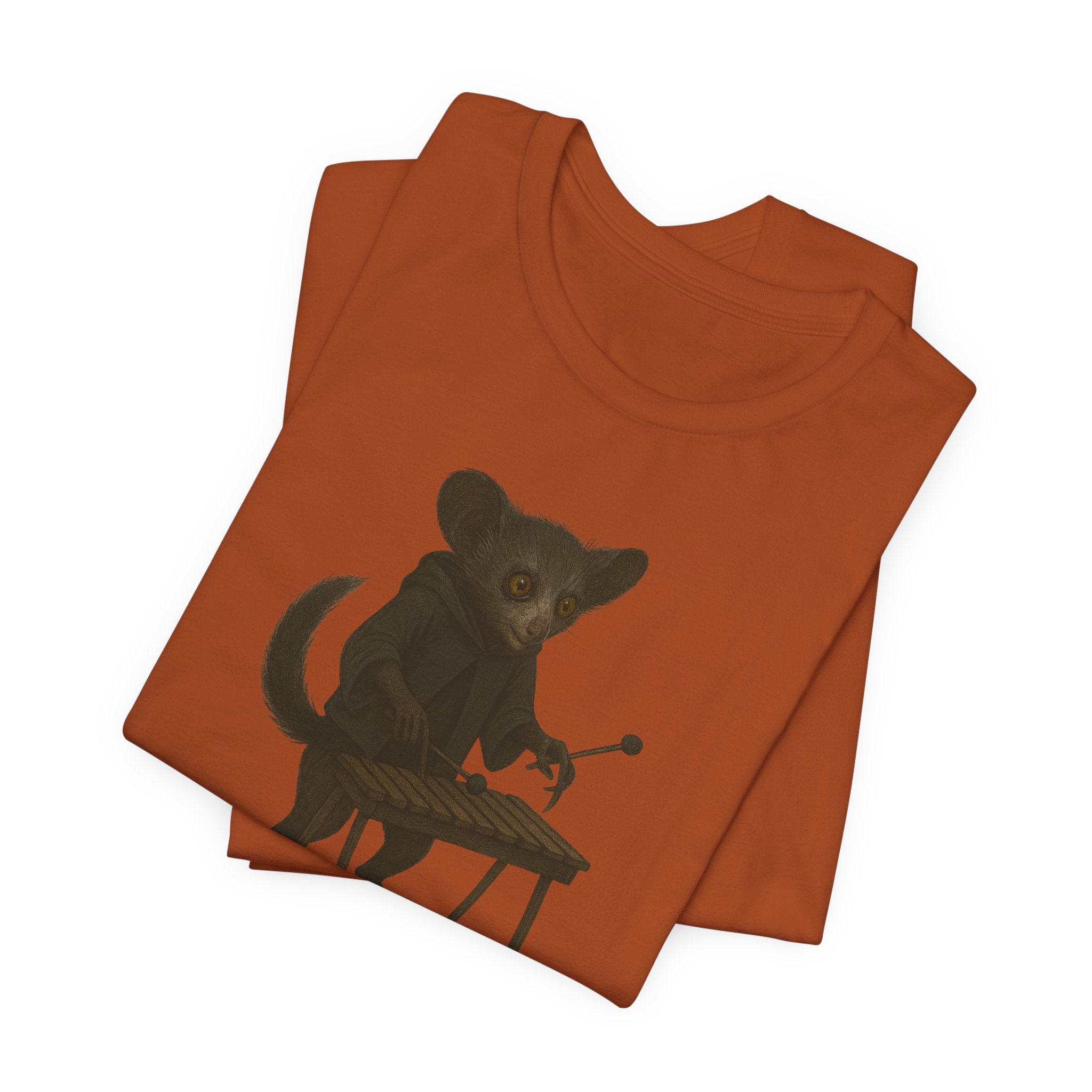 Autumn t-shirt with a graphic of an aye-aye playing a xylophone on a white background
