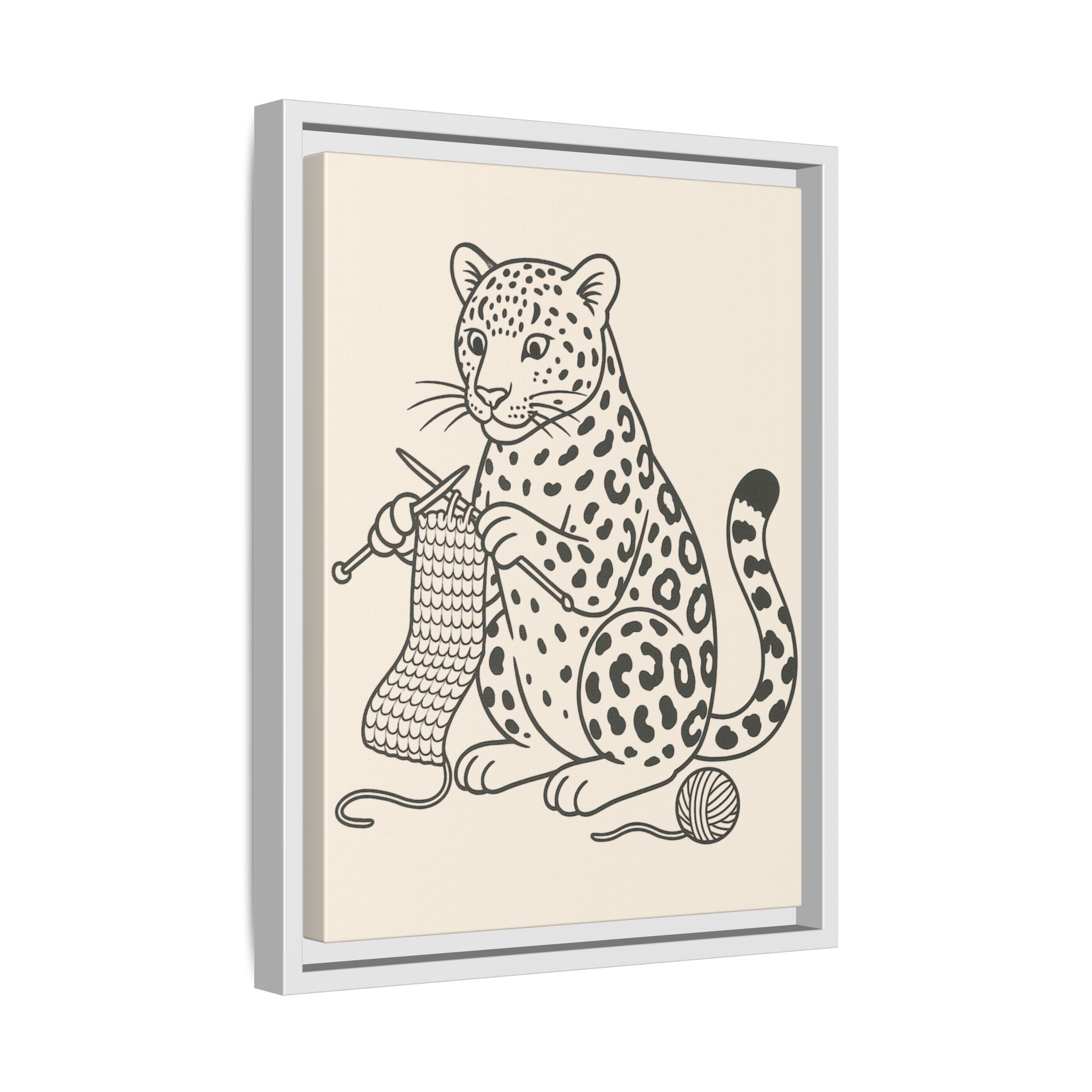 Framed artwork of an amur leopard knitting with yarn on a beige background