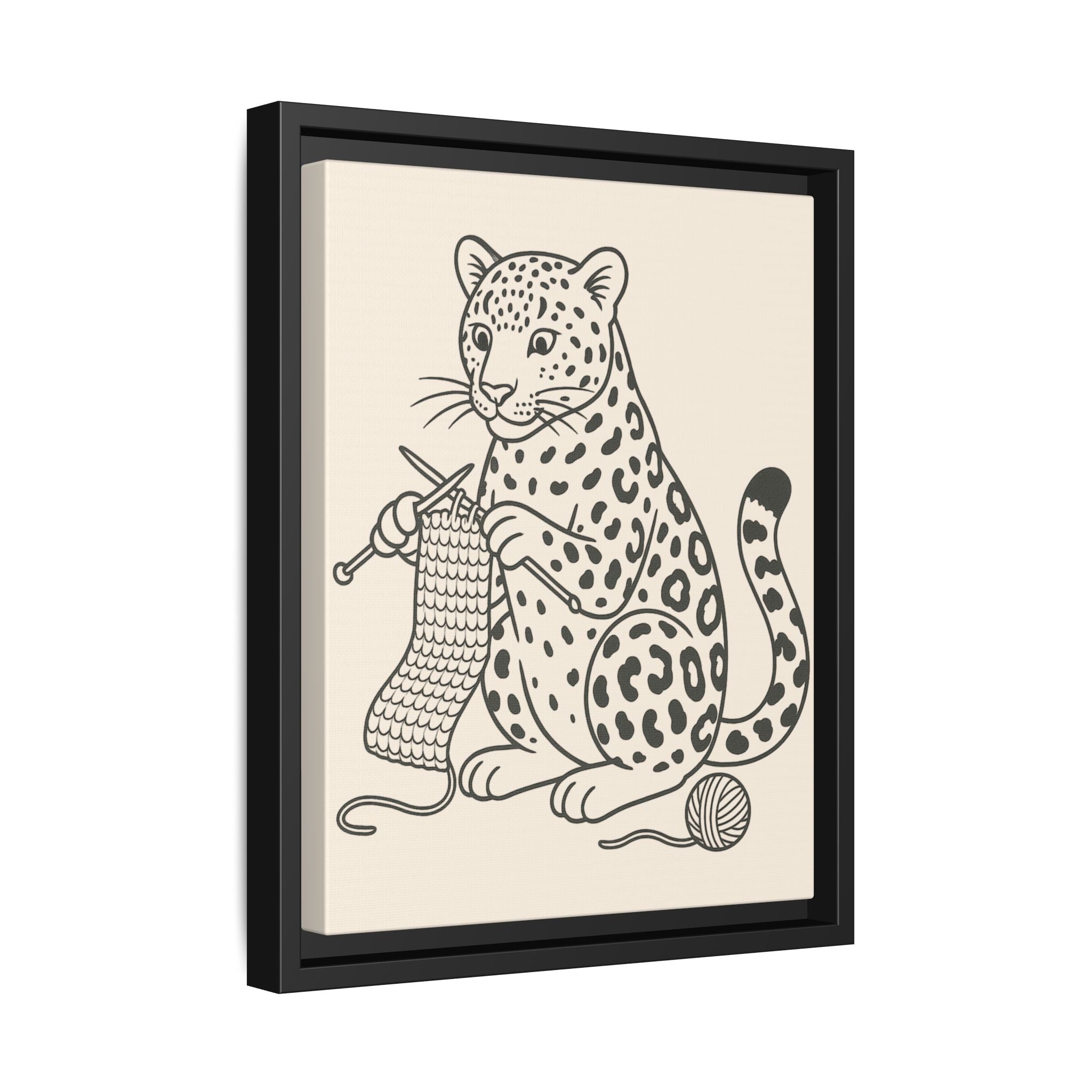 Framed artwork of an amur leopard knitting with yarn on a beige background