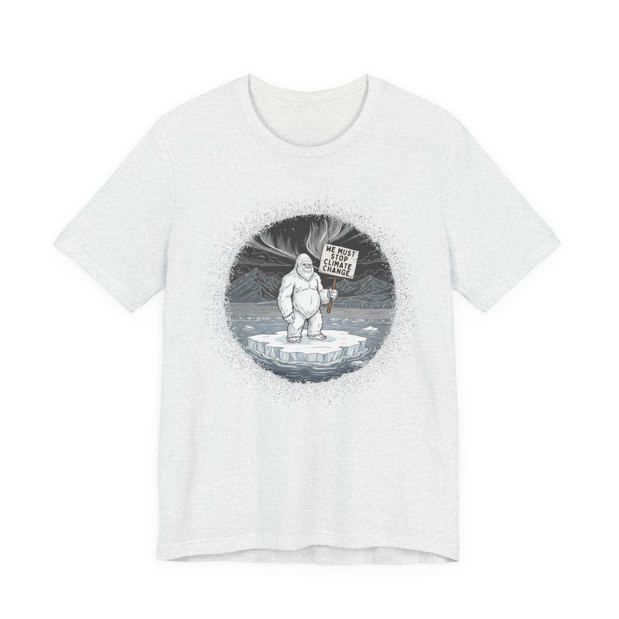 White t-shirt with a graphic of a Yeti on an ice floe holding a sign with the text "We must stop climate change" by Soon To Be Mythical