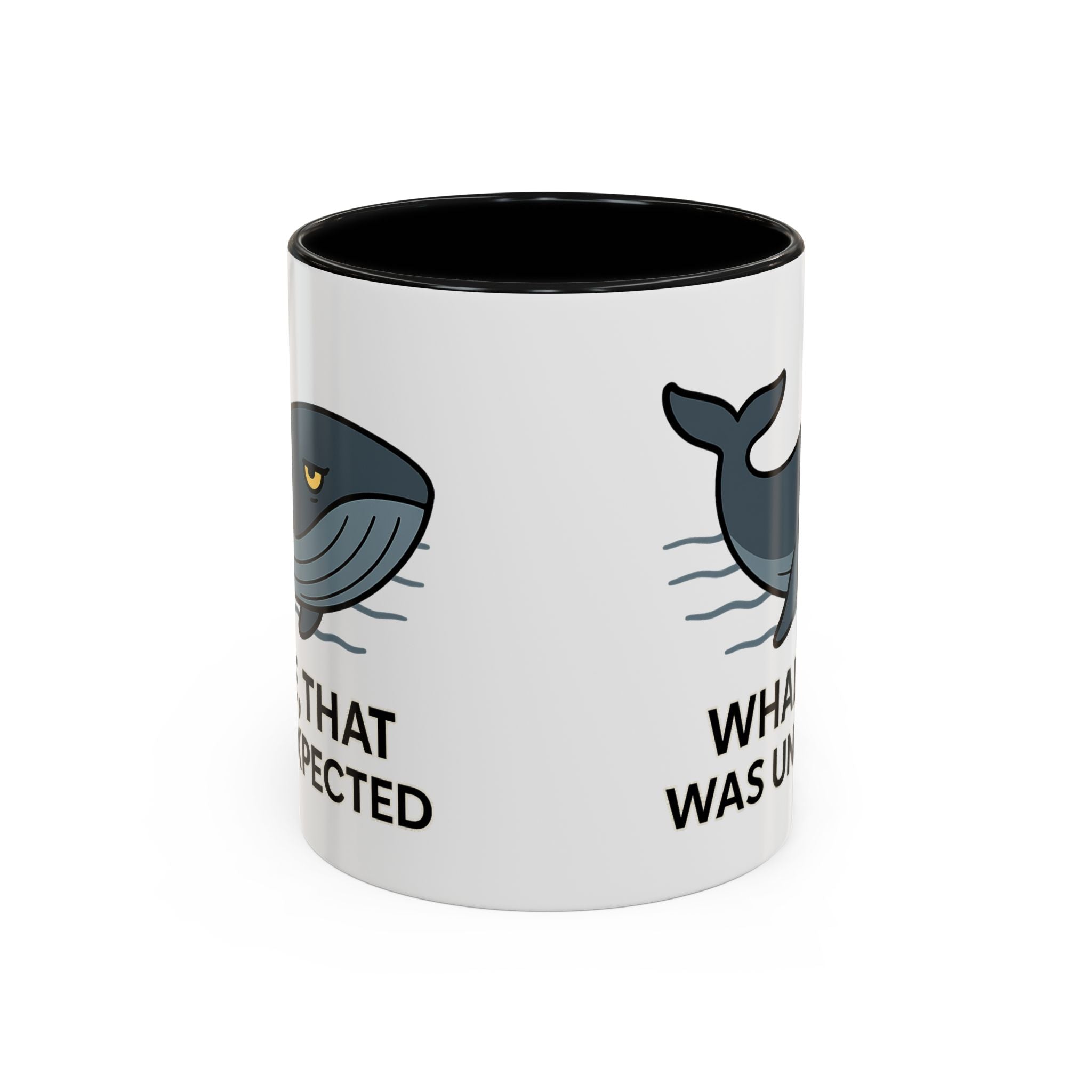 White Mug with black color accent with a blue whale design and text "Whale, that was unexpected" on a white background