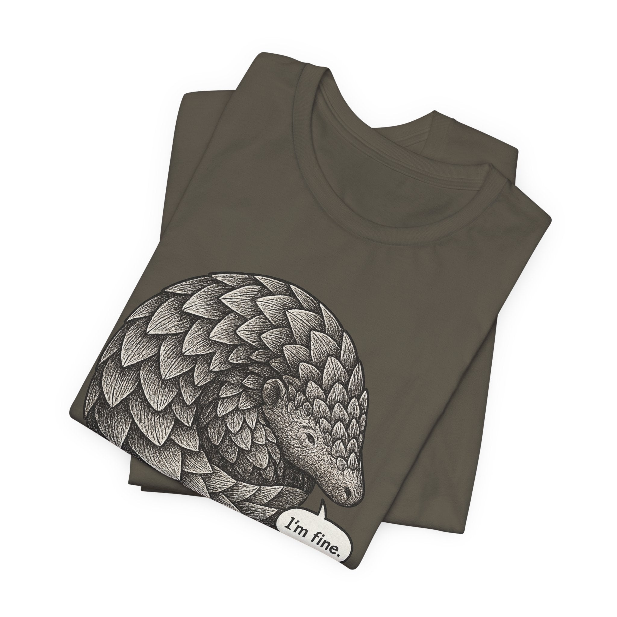 Folded army green t-shirt with a pangolin illustration and 'I'm fine.' text on a white background