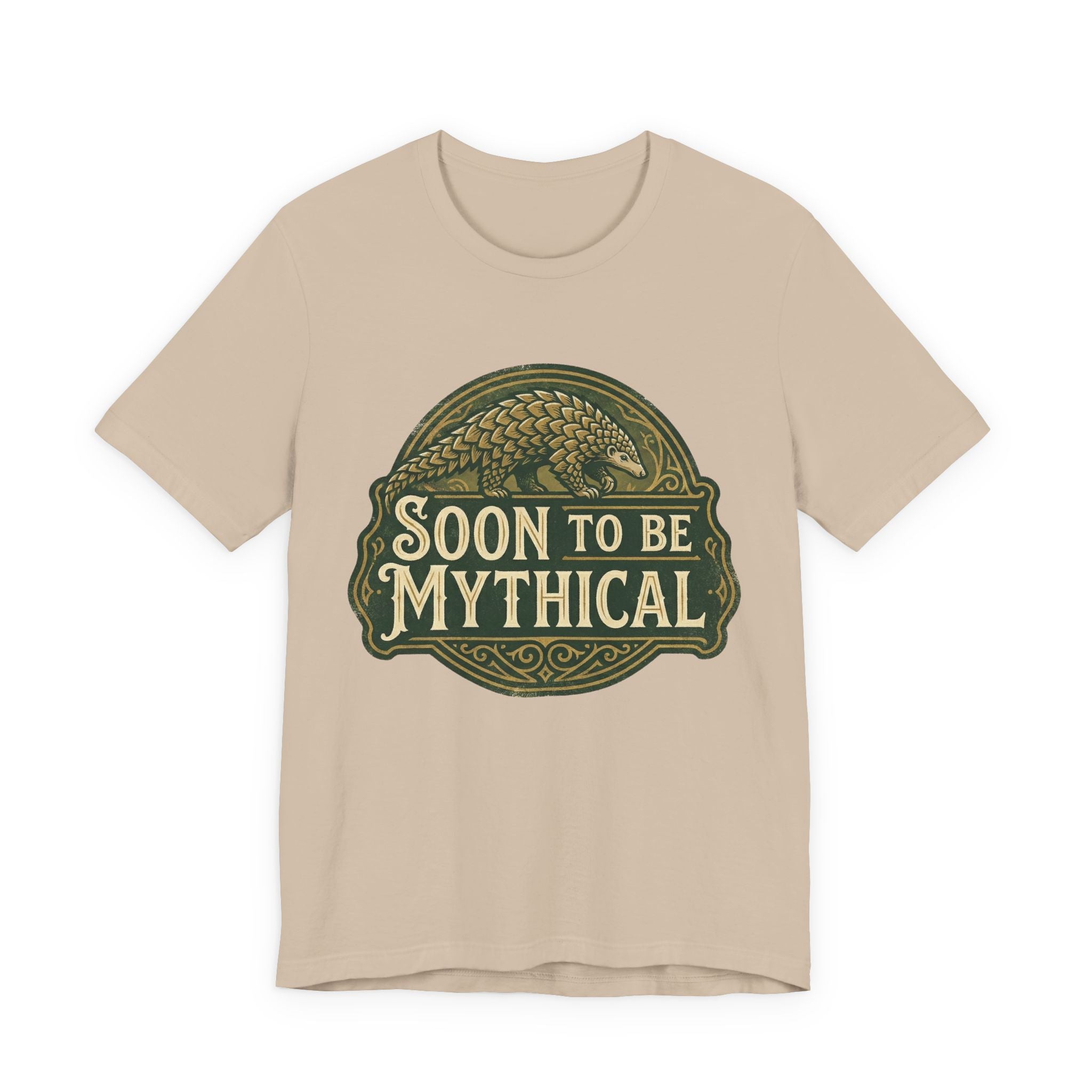 Beige t-shirt with 'Soon to be Mythical' vintage logo with a pangolin on a white background