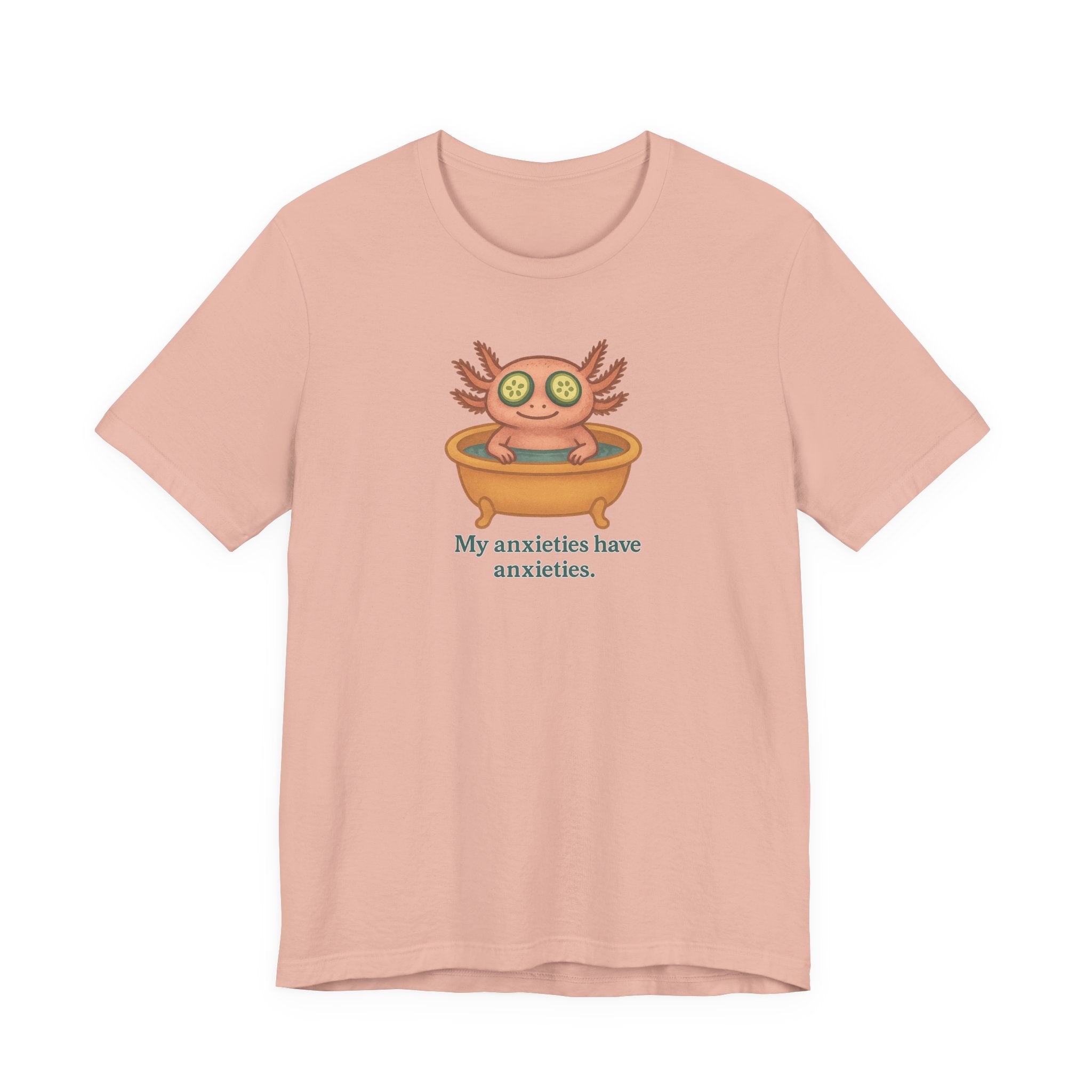 Peach t-shirt with a cartoon axolotl and text &quot;My anxieties have anxieties&quot; on a white background