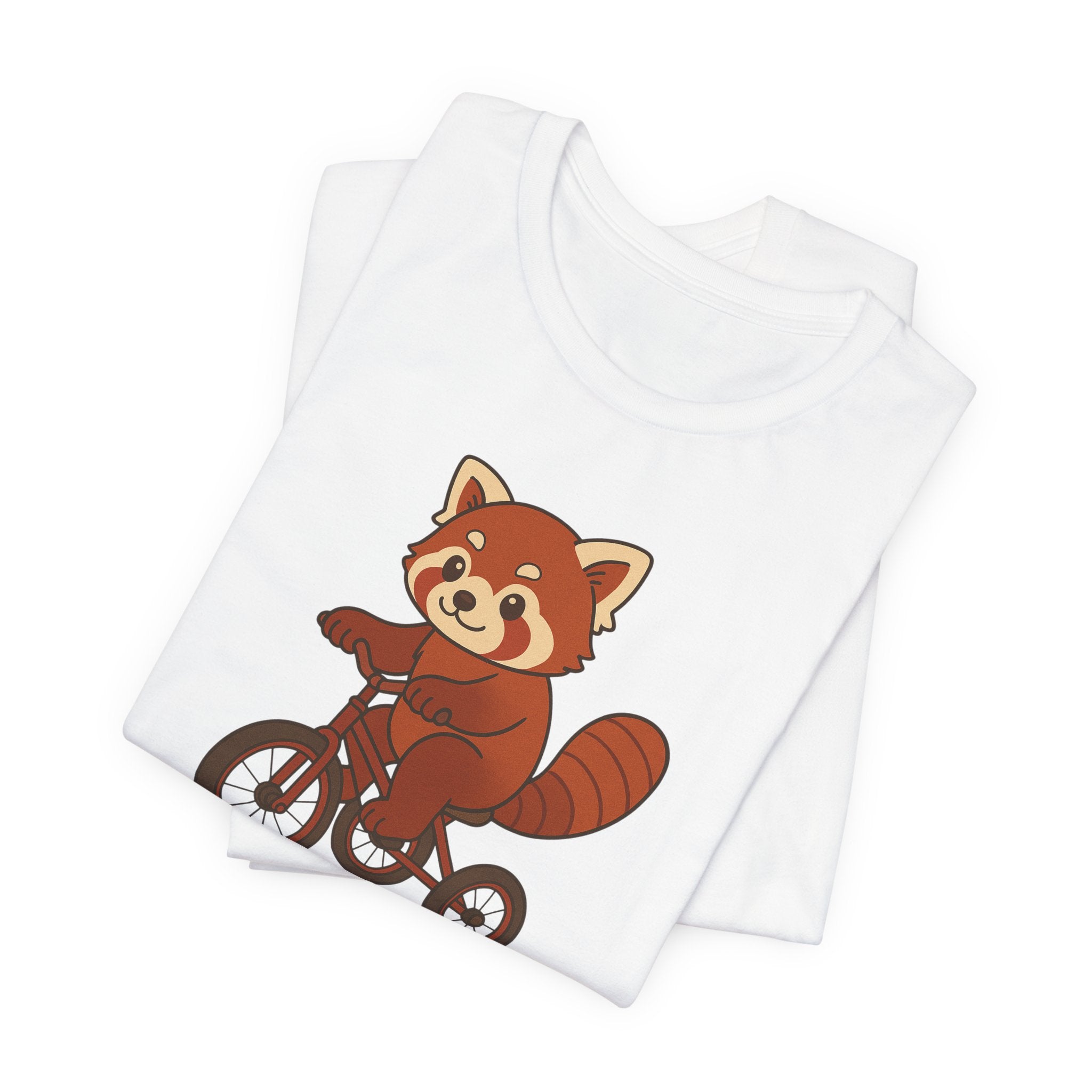 Folded white t-shirt with a red panda riding a tricycle graphic on a white background