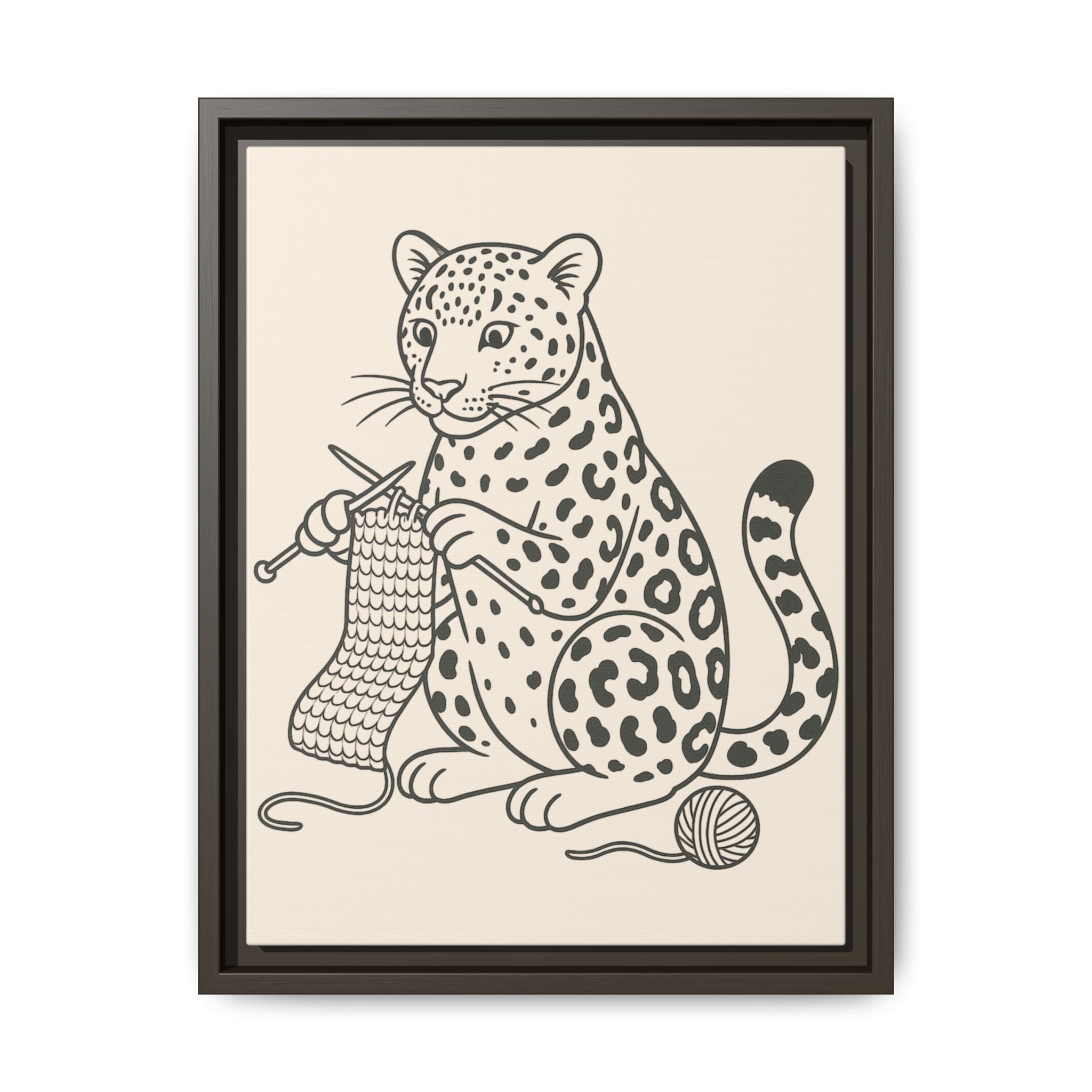 Framed artwork of an amur leopard with knitting needles and yarn on a beige background