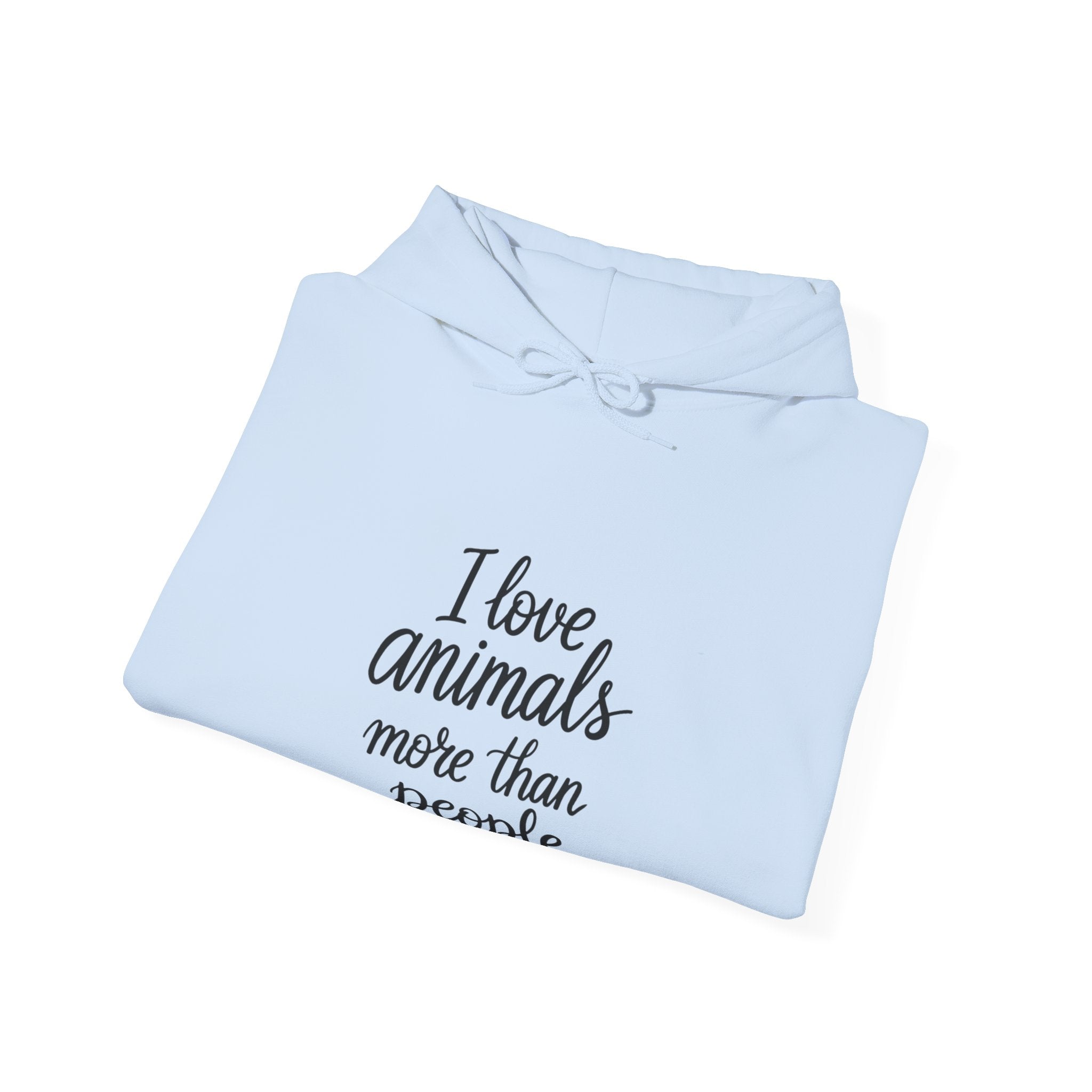 Folded light blue hoodie with text 'I love animals more than people' by Soon To Be Mythical