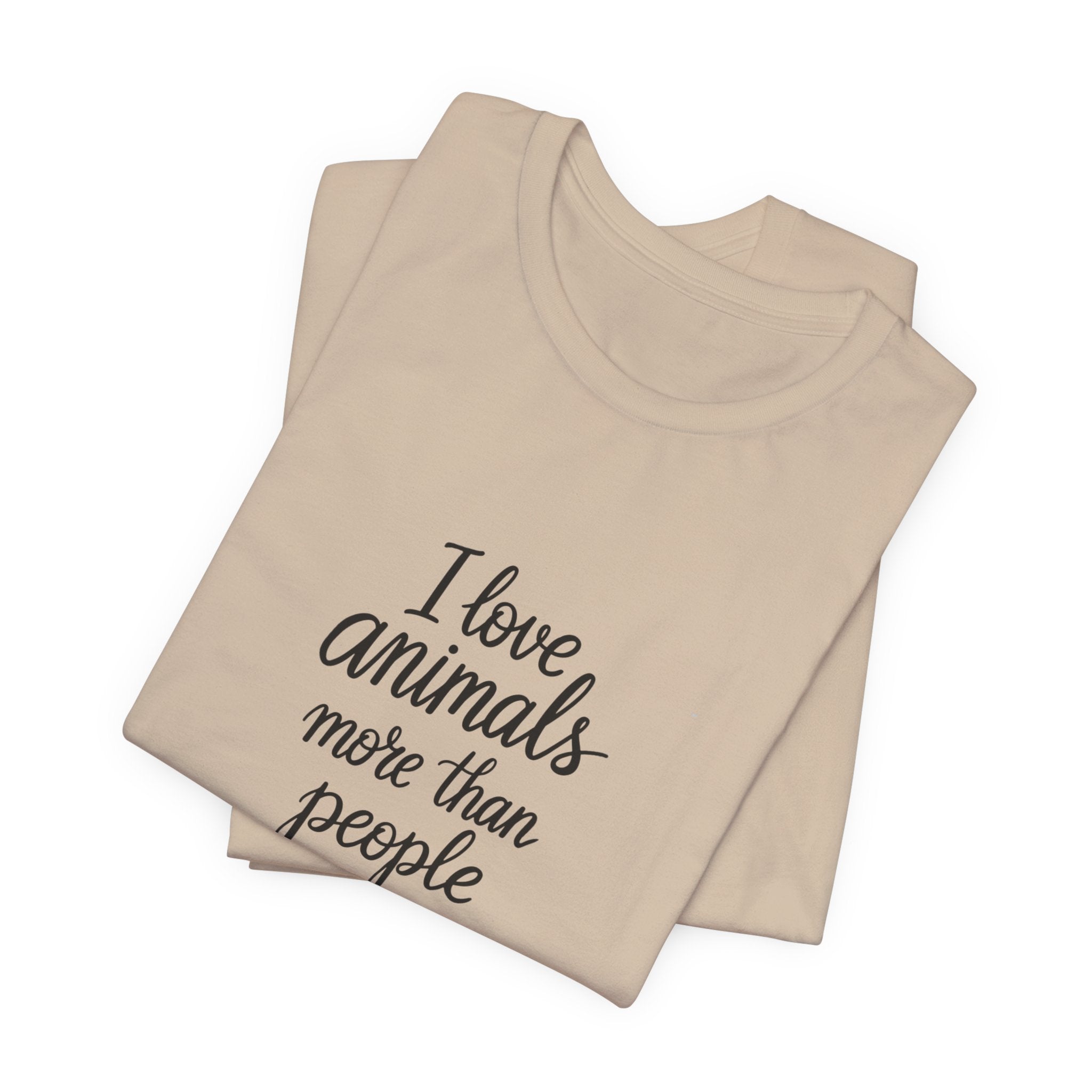 Tan t-shirt with the text "I Love Animals More Than People" on the front and the text "Postpone the Myth" on the left sleeve on a white background
