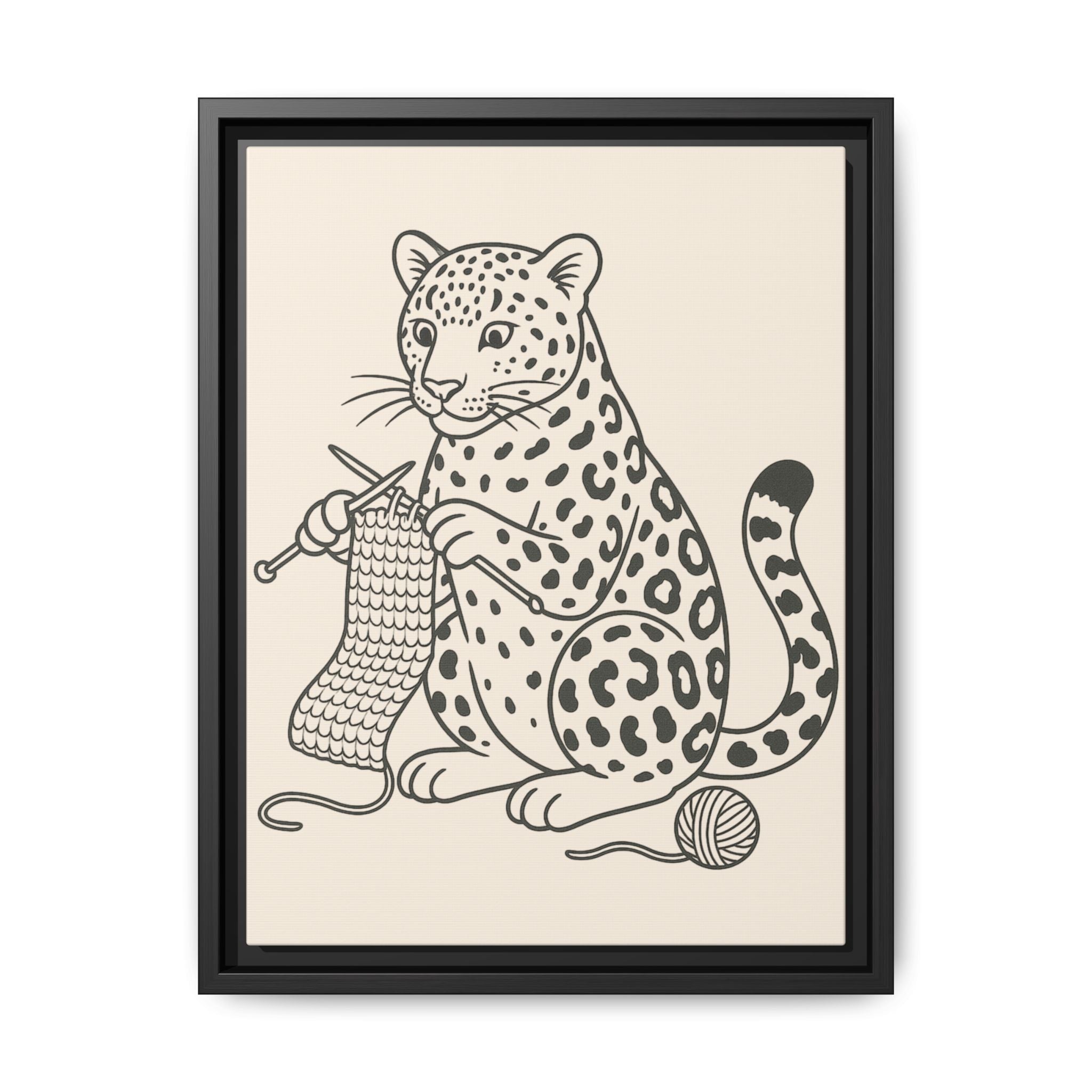 Framed artwork of an amur leopard with knitting needles and yarn on a beige background