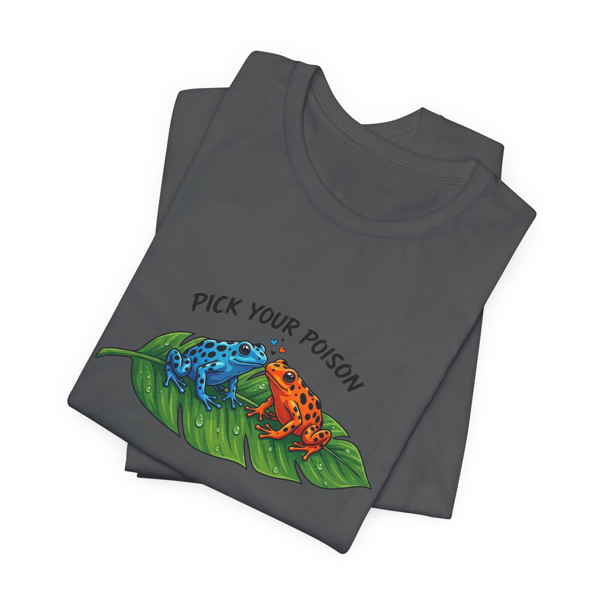 Folded gray t-shirt with a graphic of two poison dart frogs on a leaf and 'Pick Your Poison' text by Soon To Be Mythical