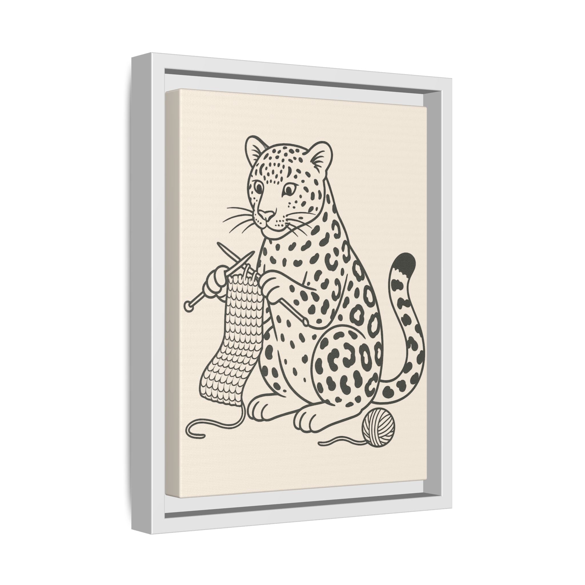 Framed artwork of an amur leopard knitting with yarn on a beige background