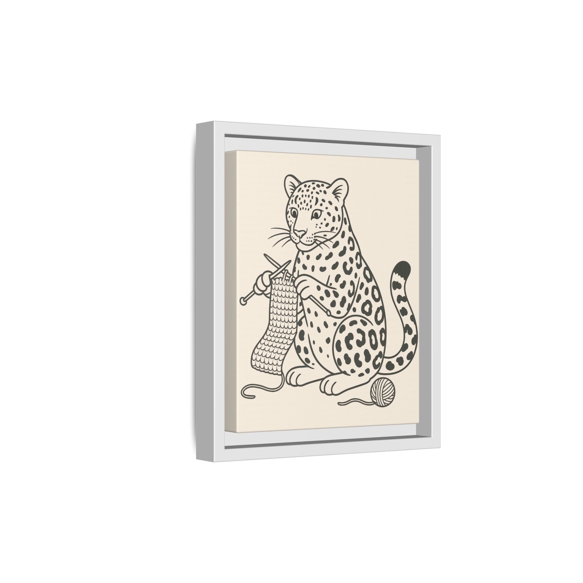 Framed illustration of an amur leopard knitting on a beige background