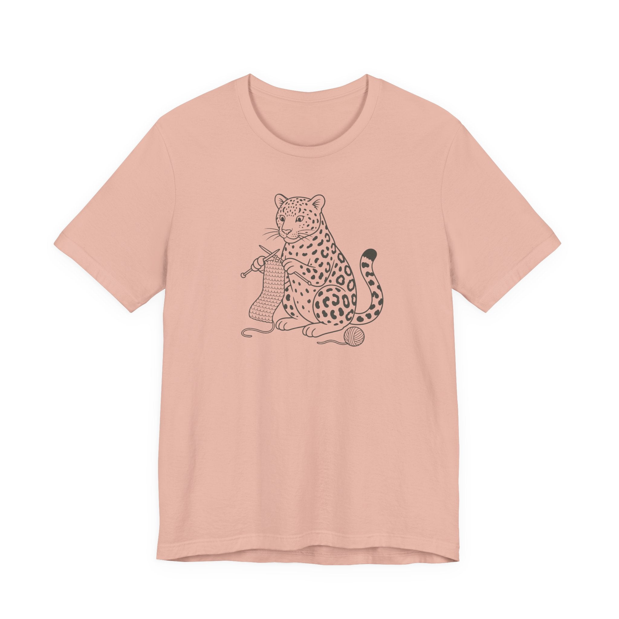 Peach t-shirt with a leopard kitting a scarf design on a white background