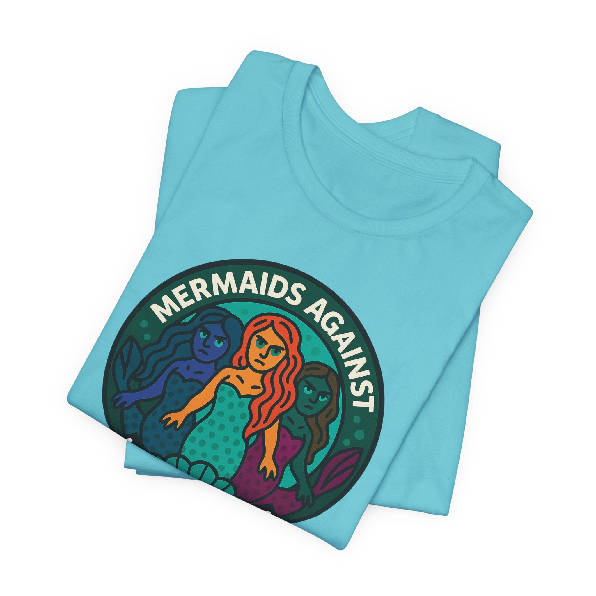 Folded turquoise t-shirt with mermaid graphic and text 'Mermaids Against Microplastics' by Soon To Be Mythical