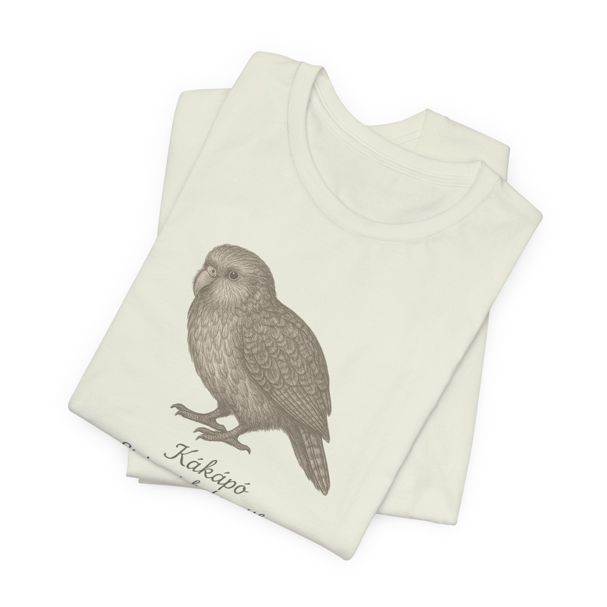 Citron t-shirt with a kakapo bird graphic and text of its scientific name on a white background