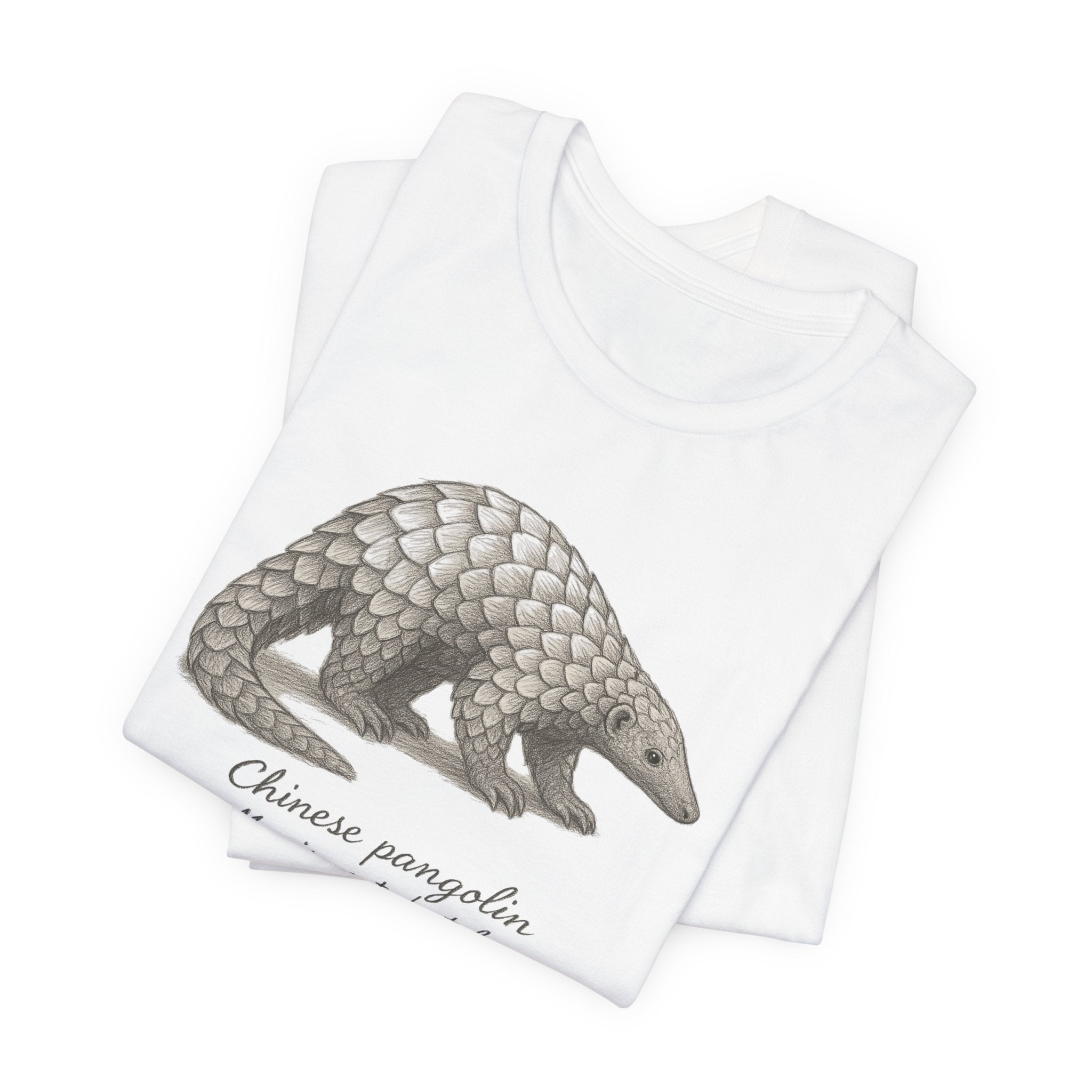 Folded white t-shirt with a chinese pangolin graphic with text on a white background