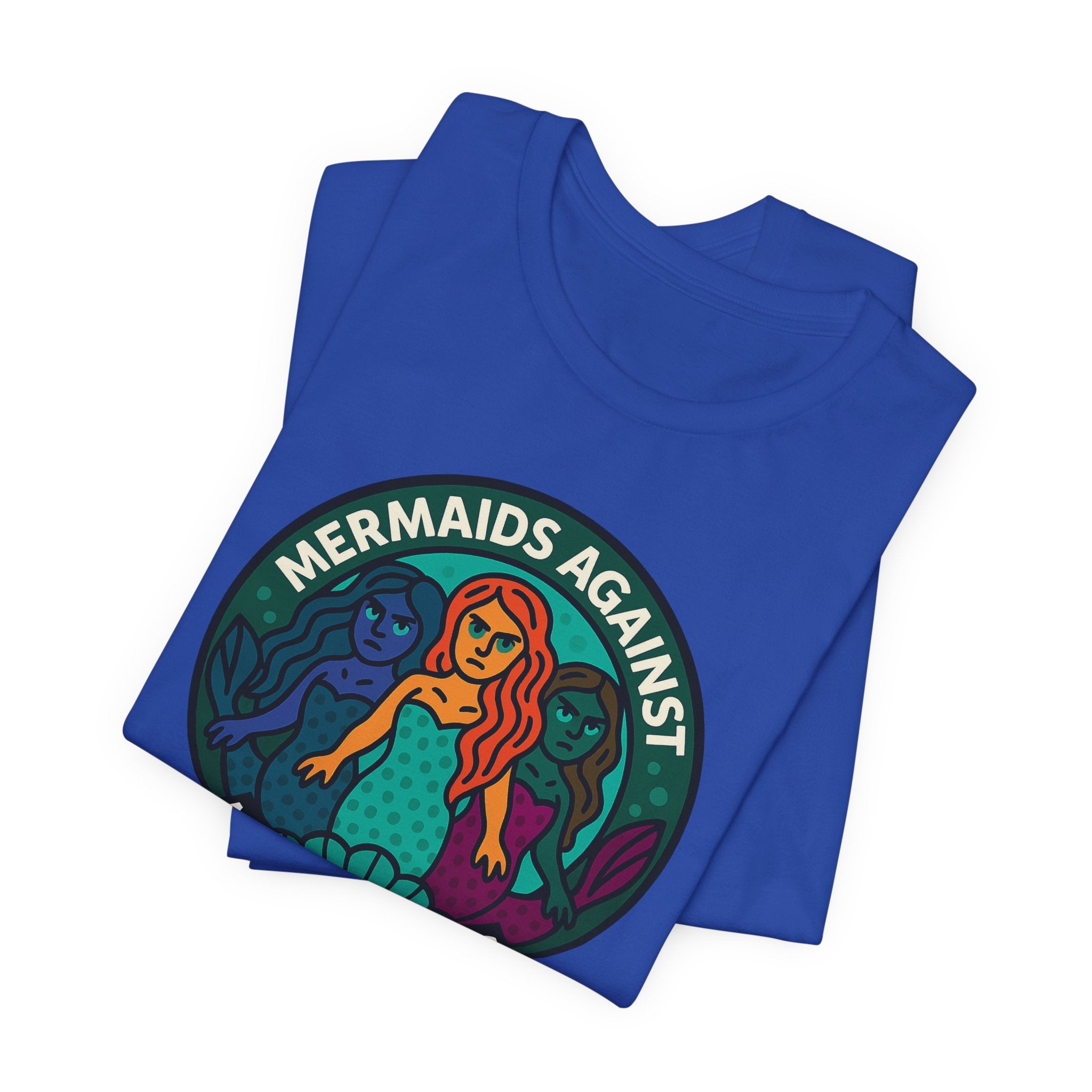 Folded blue t-shirt with mermaid graphic and text 'Mermaids Against Microplastics' by Soon To Be Mythical