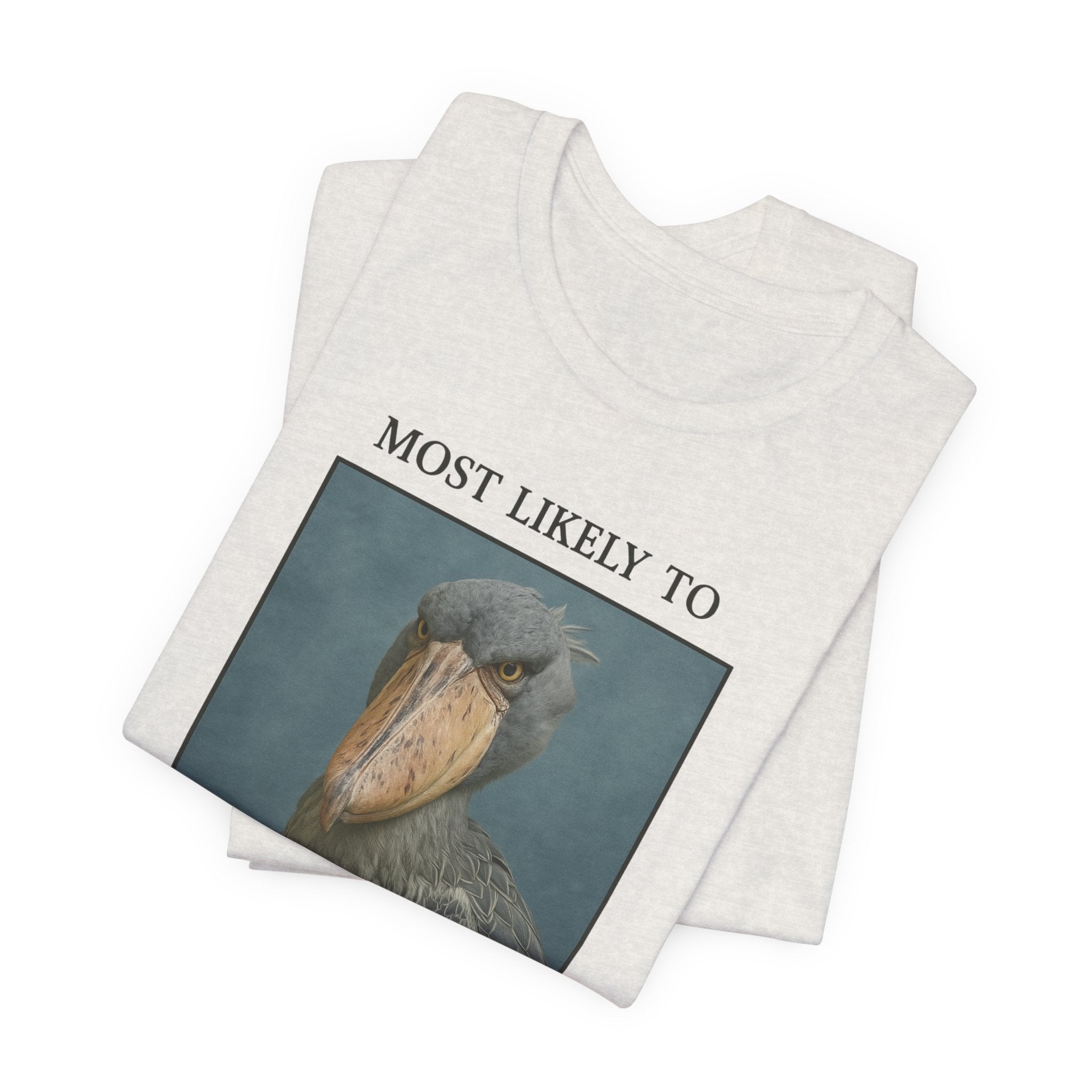 Heathered cement t-shirt with shoebill stork yearbook picture that says "Most Likely to Silently Judge Your Life Choices" on a white background