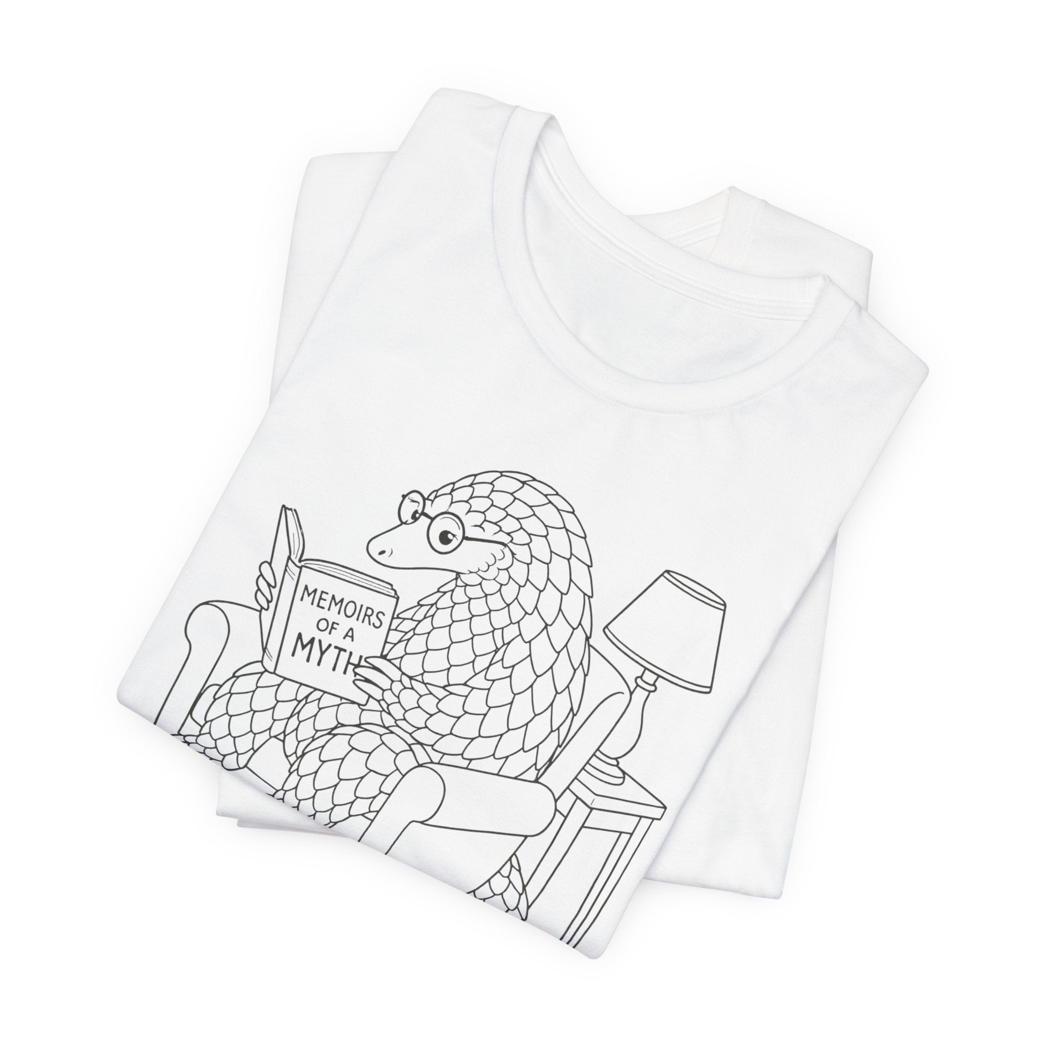 White t-shirt with black graphic design of a pangolin reading 'Memoirs of a Myth' on a white background