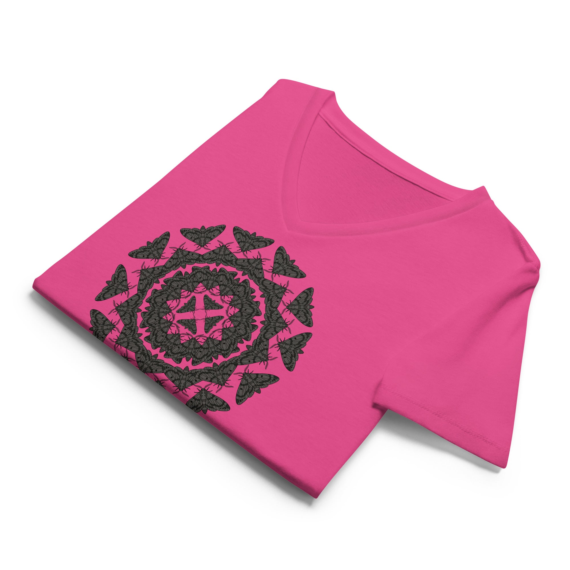 Folded pink v-neck t-shirt with a geometric pattern of the Blackburn's sphynx moth by Soon To Be Mythical