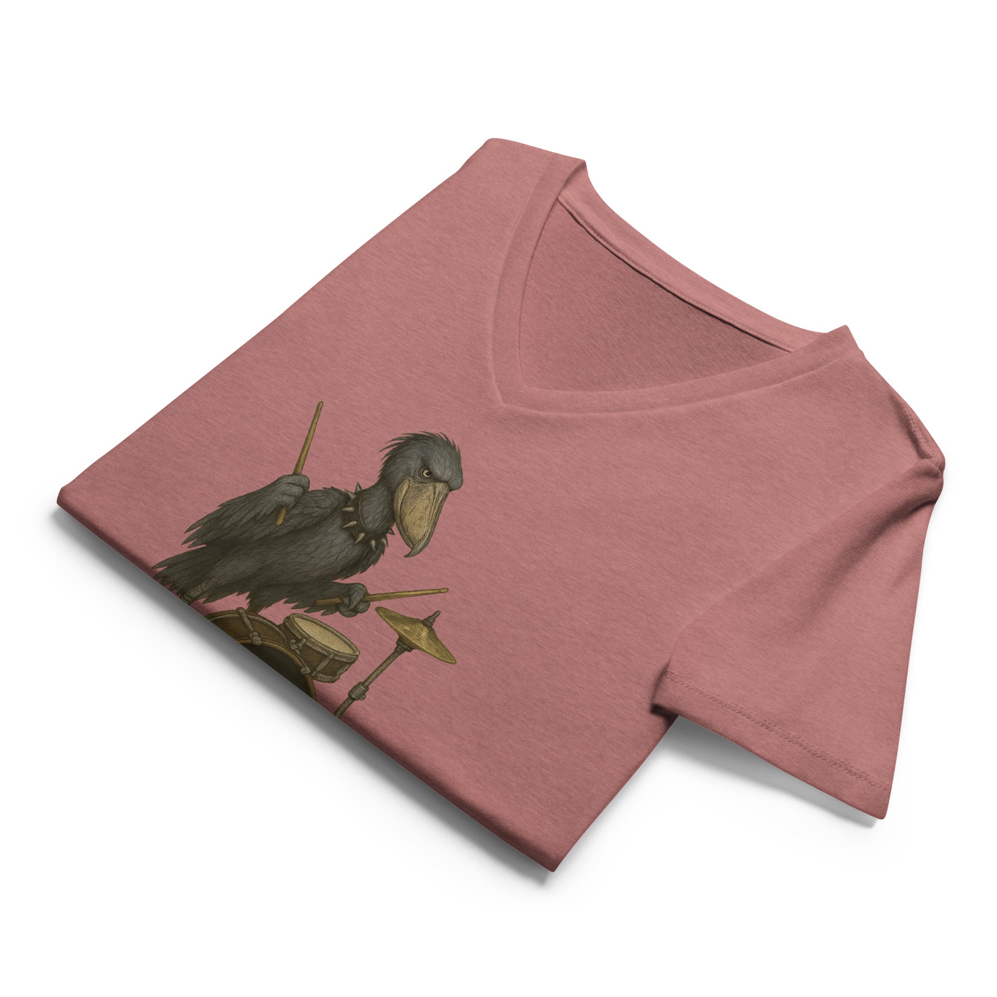 Folded mauve  v-neck t-shirt with a graphic of a shoebill stork playing drums and 'DEATH METAL' text by Soon To Be Mythical