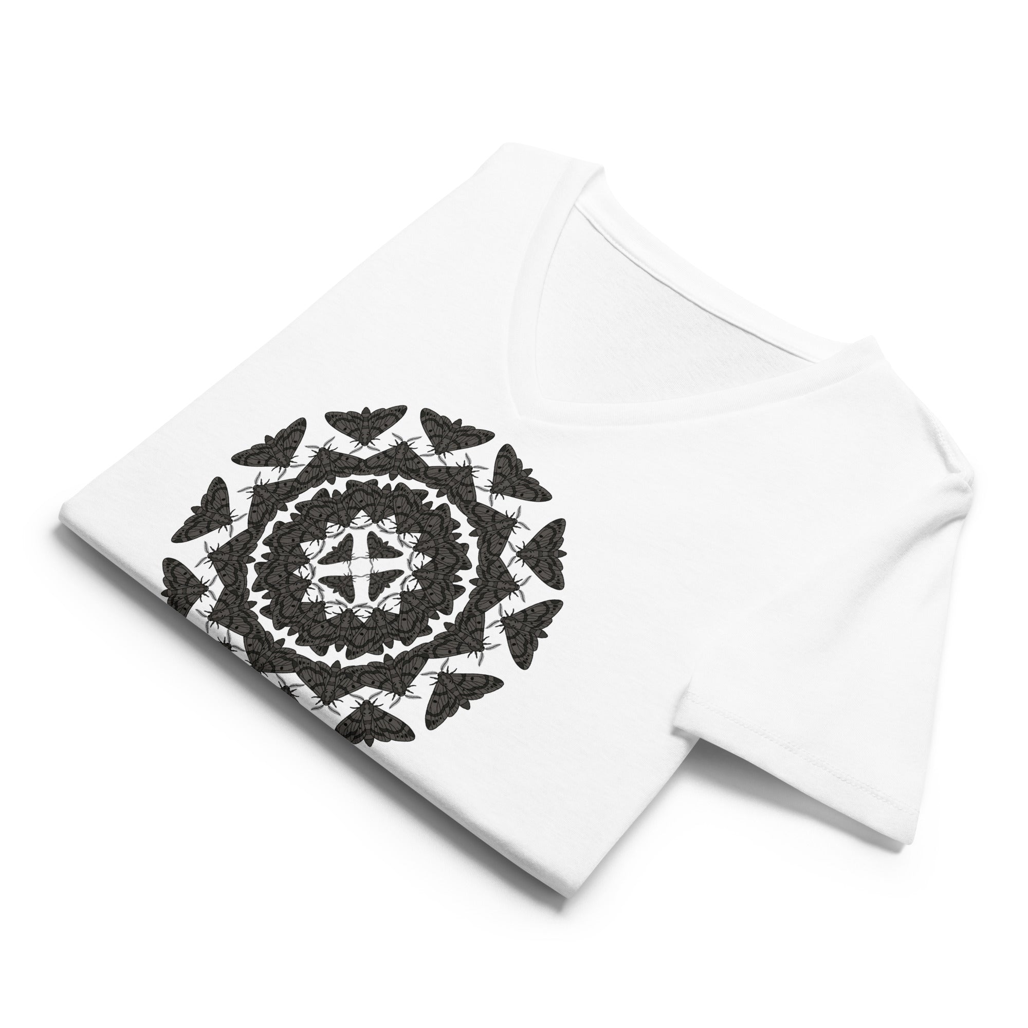 Folded white v-neck t-shirt with a geometric pattern of the Blackburn's sphynx moth by Soon To Be Mythical
